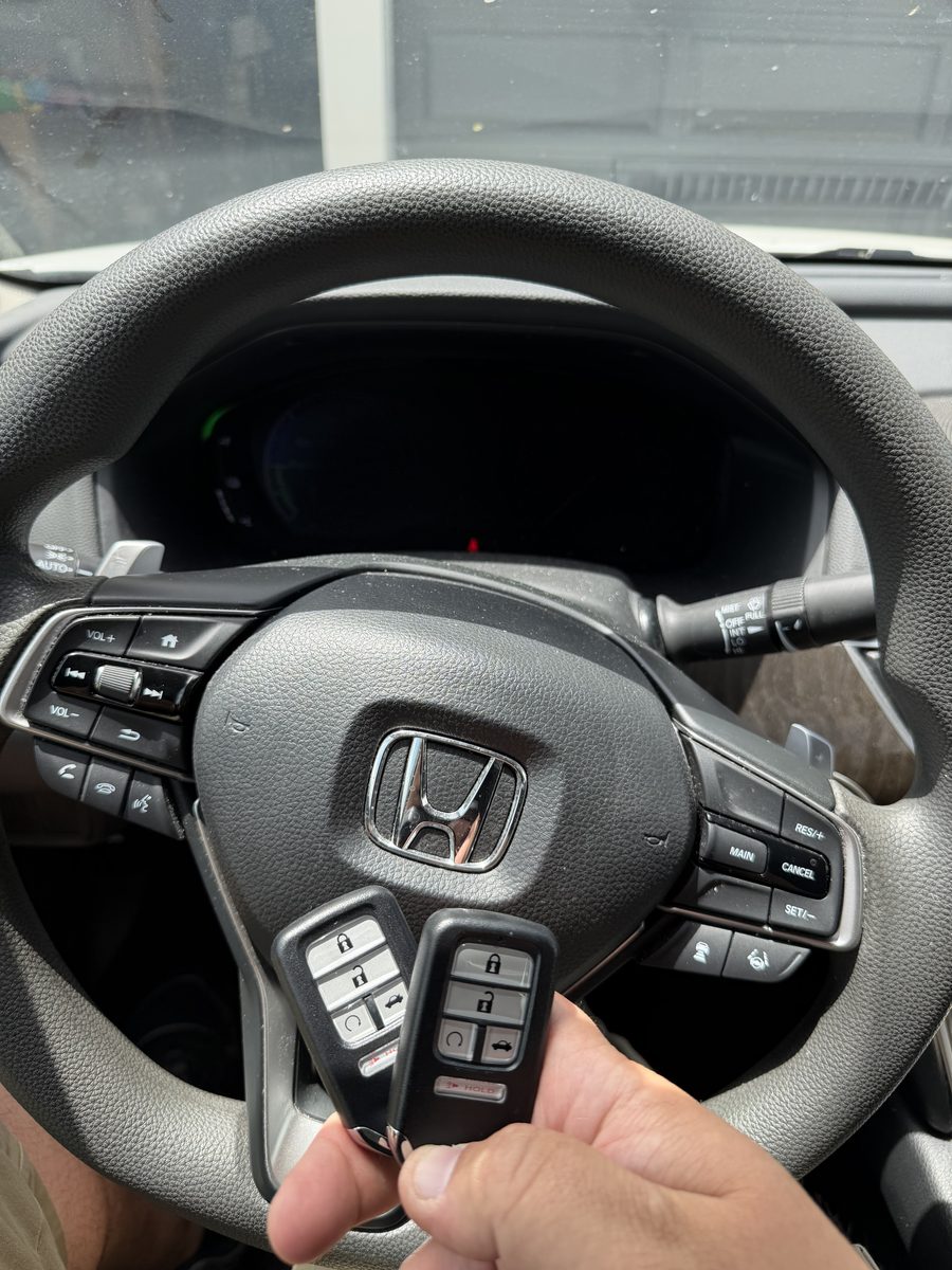Two Honda smart key fobs cut and programmed on site